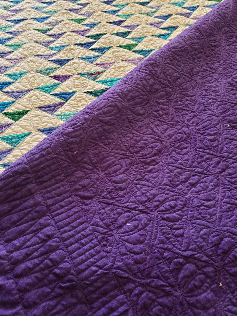 "Custom made cotton quilt with star pattern in vibrant colors