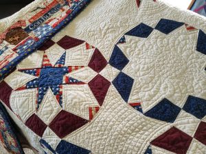 Handmade Patriotic Quilt in red, white, and blue with custom free-motion quilting