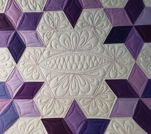 Quilts for Sale/Detailed view of the Tulip Trails quilt pattern, showcasing fine stitching and 100% cotton fabric.