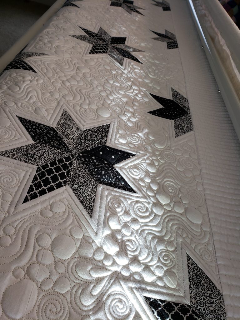 quilts for sale. Hunter’s Star custom quilt in progress with colorful cotton fabrics