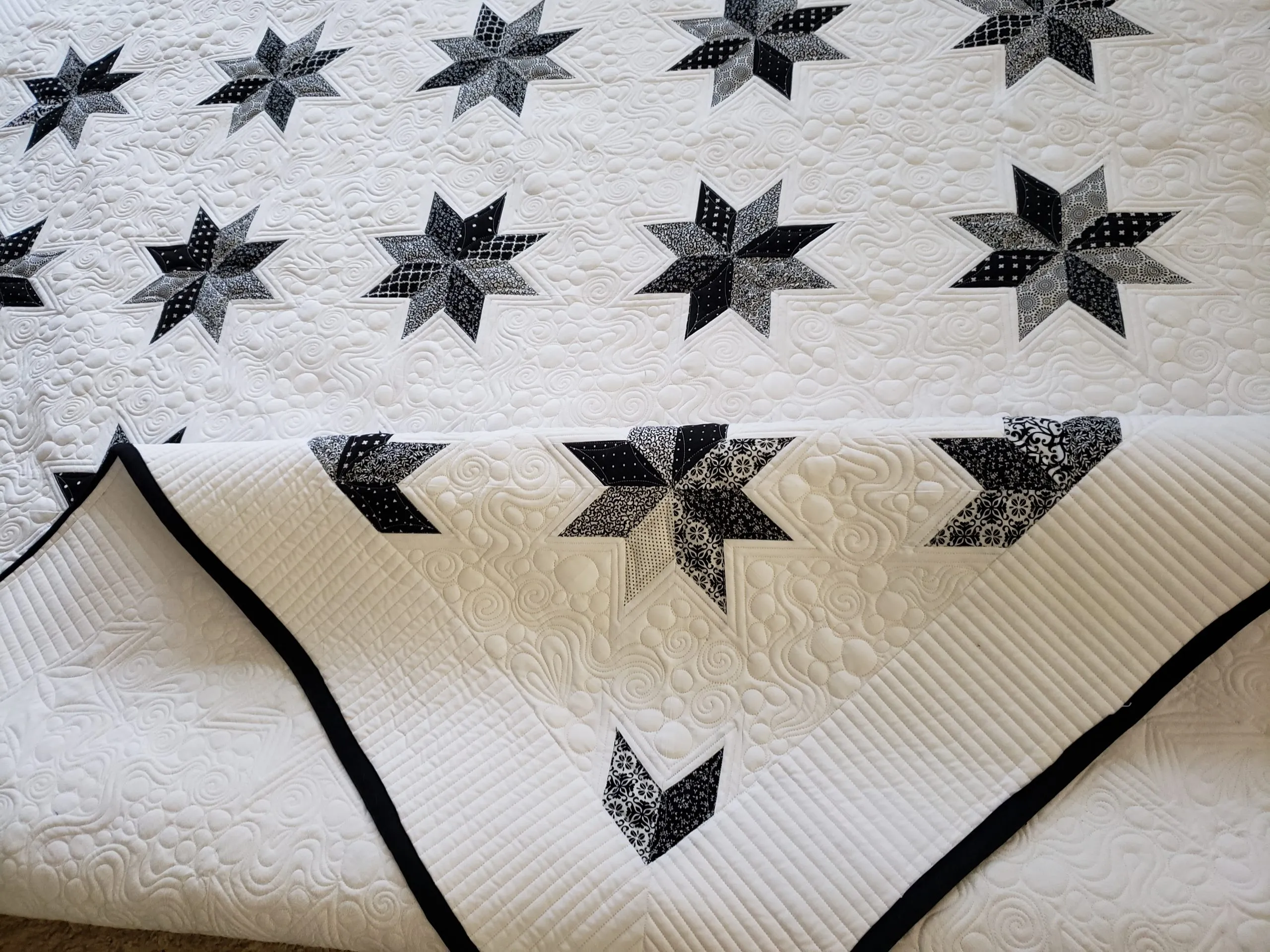 Quilts For Sale/ Quilt for Sale/ Quilt for Sale Handmade queen size black and white hunters star quilt displayed on bed