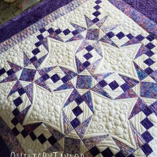 Ready-to-ship Purple Double Charmed quilt displaying beautiful texture and dimension