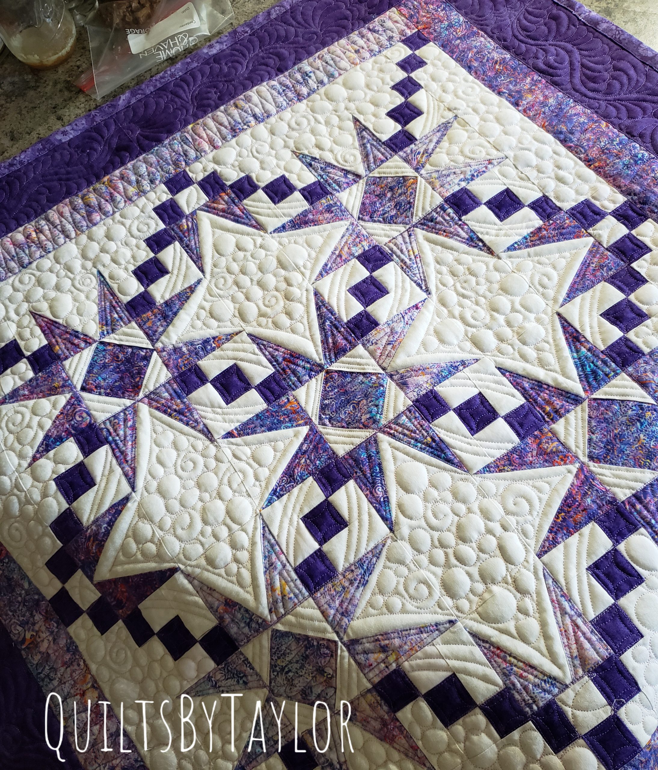 Ready-to-ship Purple Double Charmed quilt displaying beautiful texture and dimension