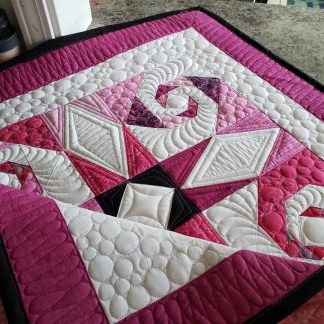 Pink Whimsical Storm At Sea quilt with Snail's Trail blocks